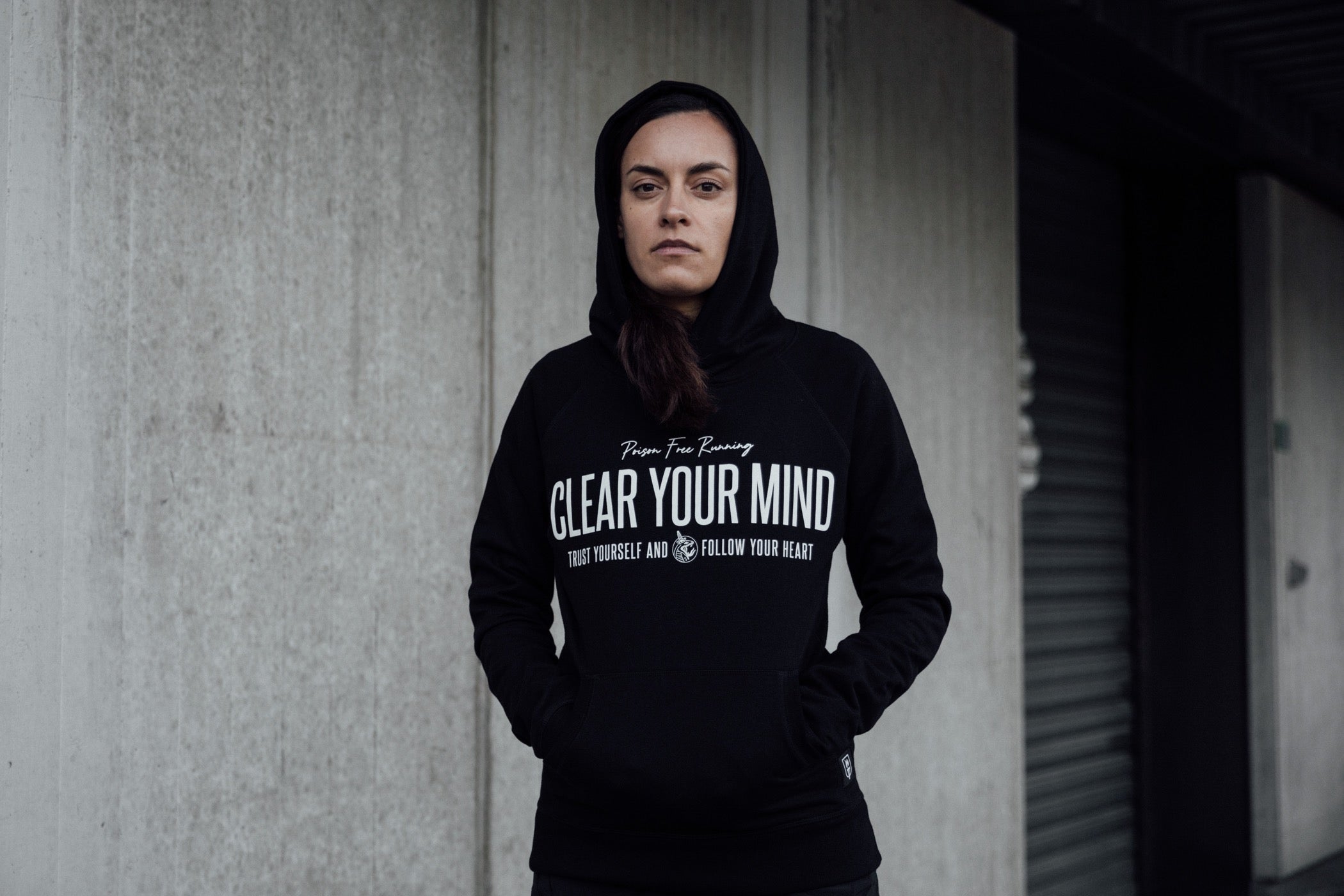 Female Runner wearing a Clear Your Mind Hooded Sweater