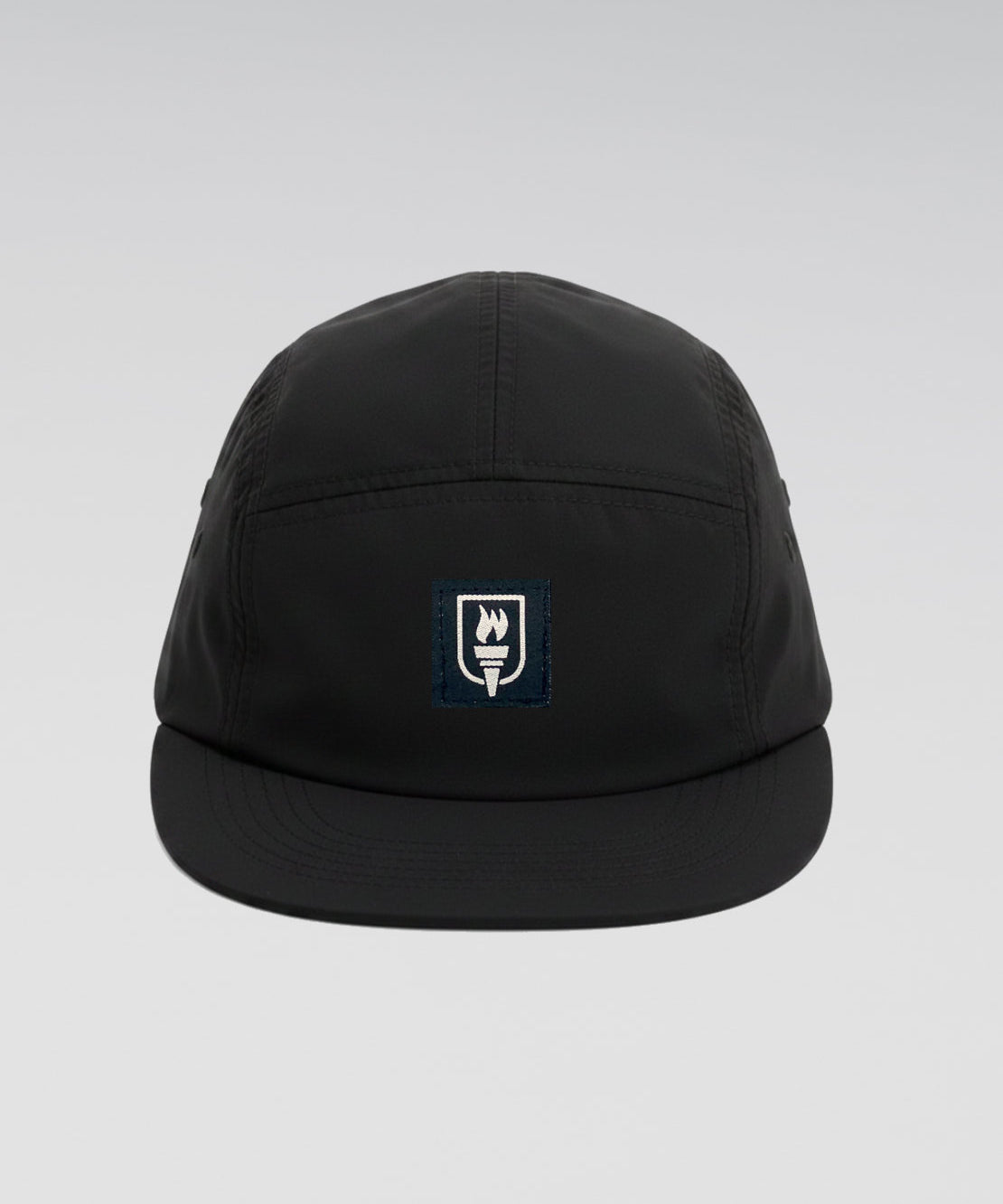 Black cap with a logo on a light gray background