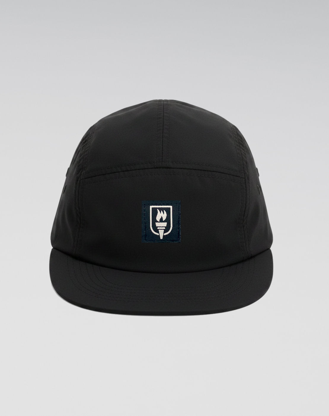 Black cap with a logo on a light gray background