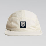 Beige cap with a logo on a light gray background