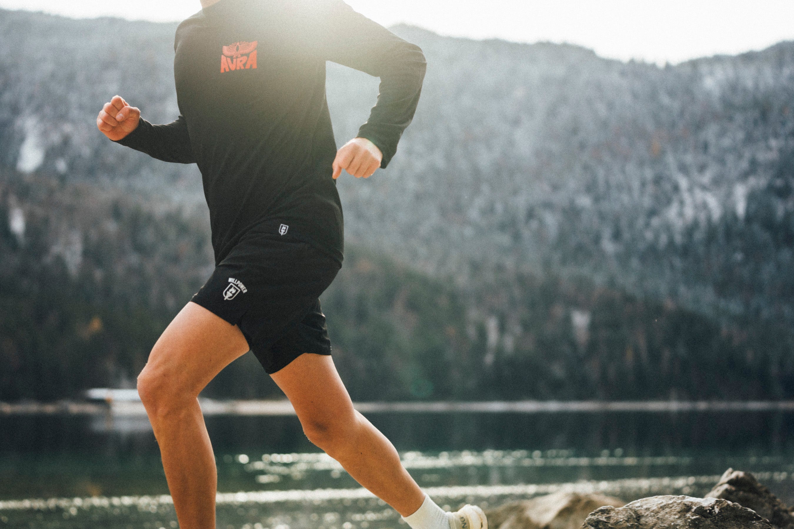 Person running outdoors with a scenic background