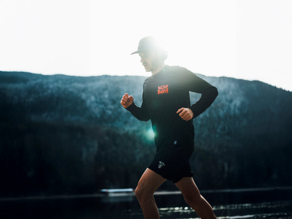 Person running outdoors with a scenic background
