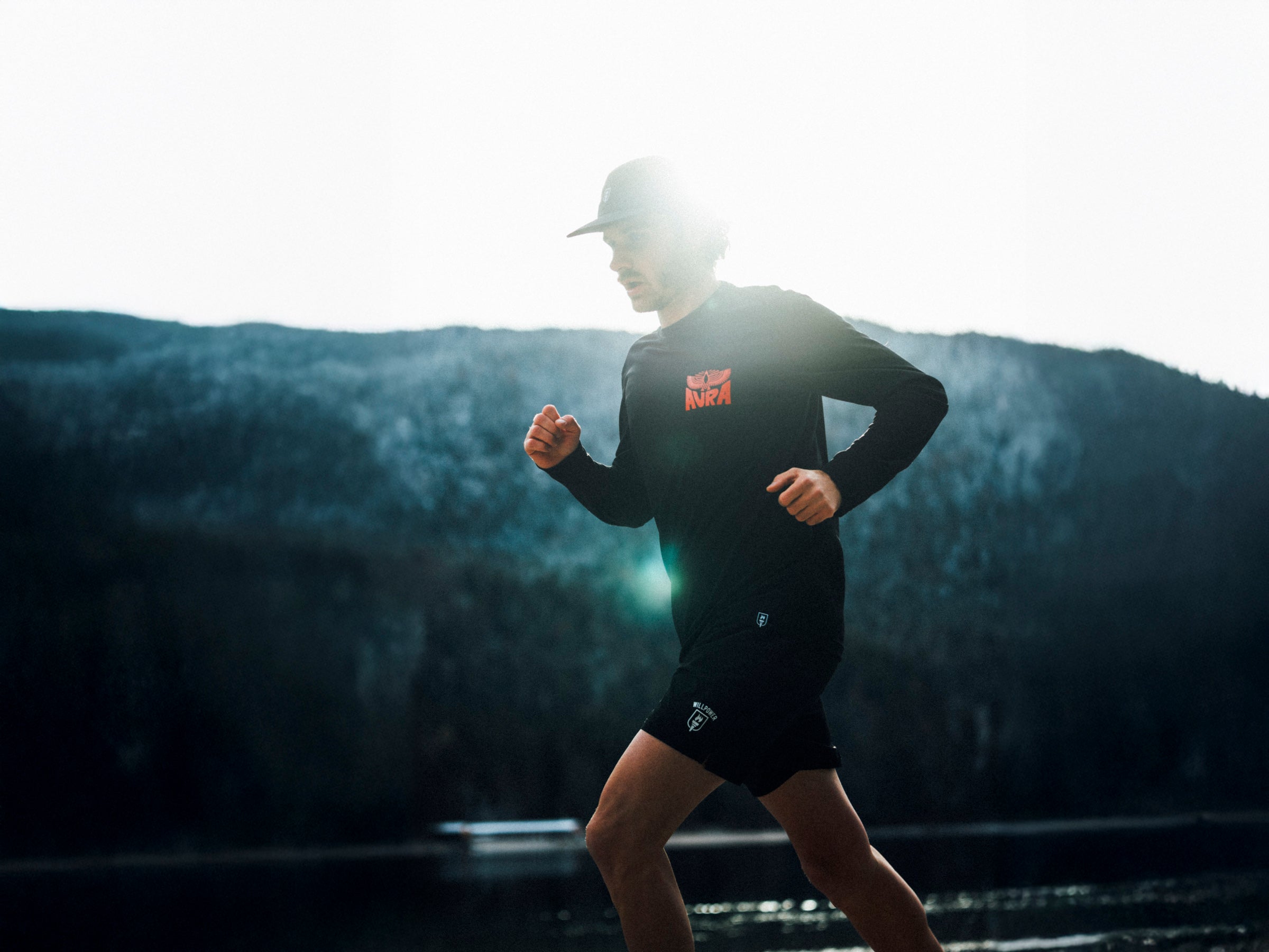 Person running outdoors with a scenic background