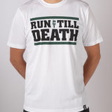 A male model wearing a white t-shirt with the text 'Run Till Death' printed in grey on the front.